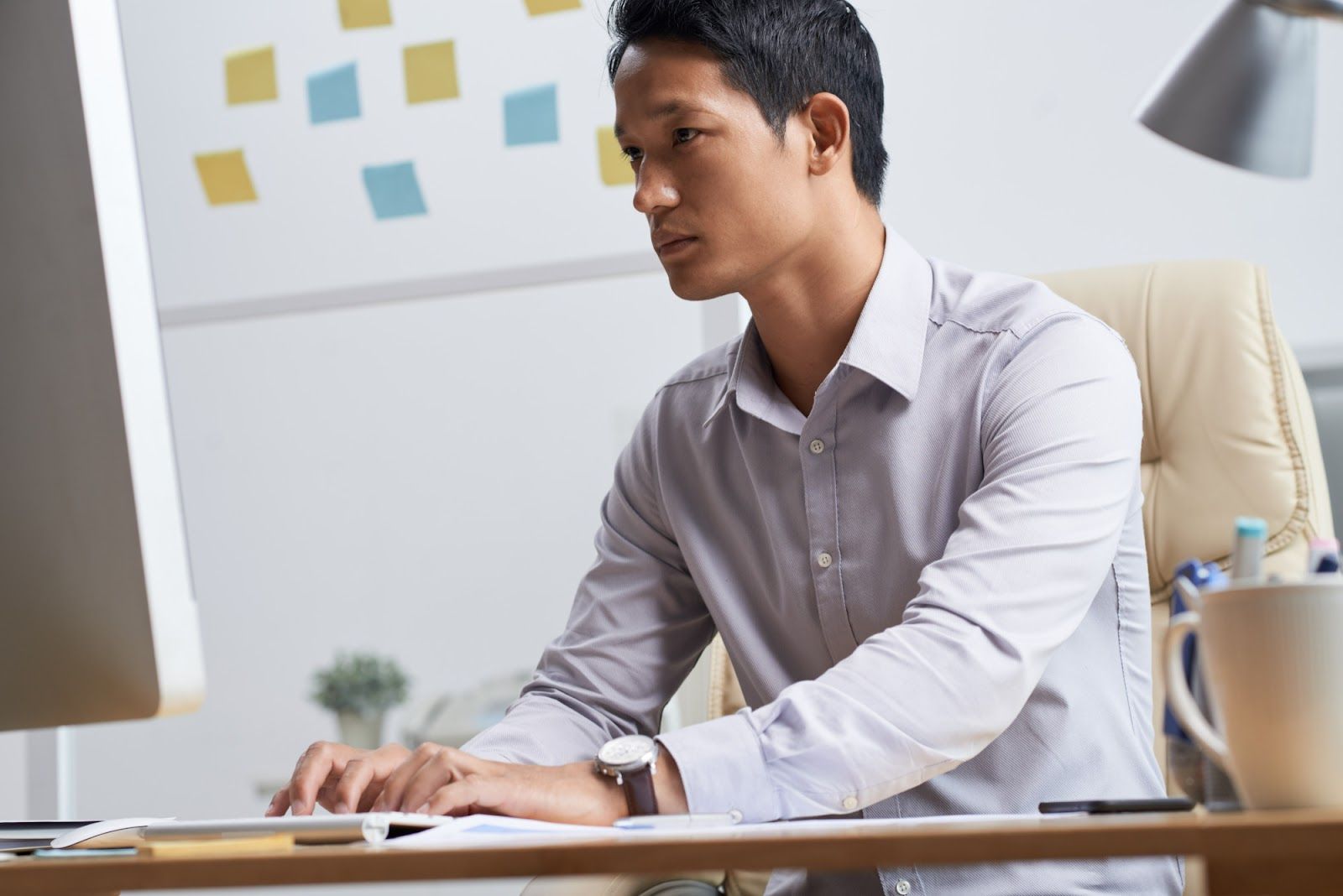 A person sitting at a desk using a computerAI-generated content may be incorrect.